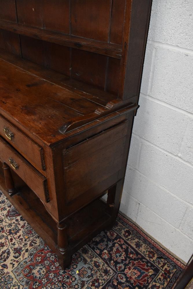 An 18th century oak dresser with boarded plate rack back with five drawers raised on block feet, - Image 4 of 4