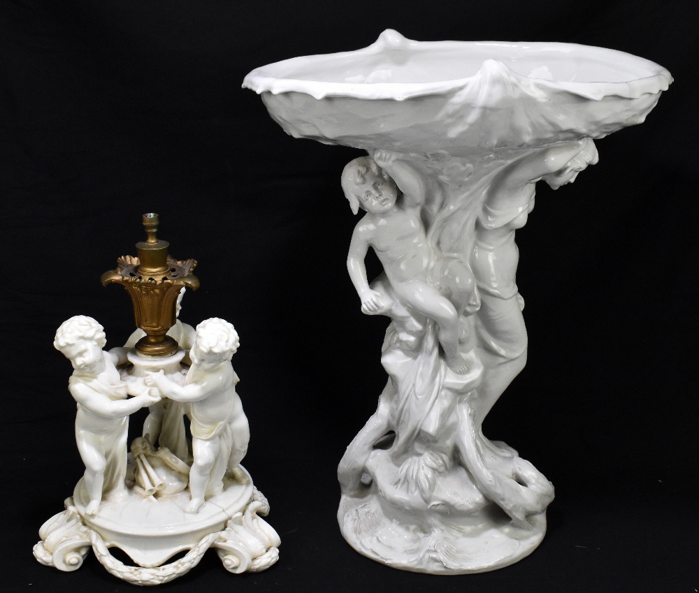 ROYAL DUX; a blanc-de-chine centrepiece, with a further blanc-de-chine table lamp decorated with