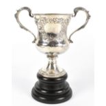 ROBERT HENNELL II; a William IV hallmarked silver twin handled trophy with embossed foliate