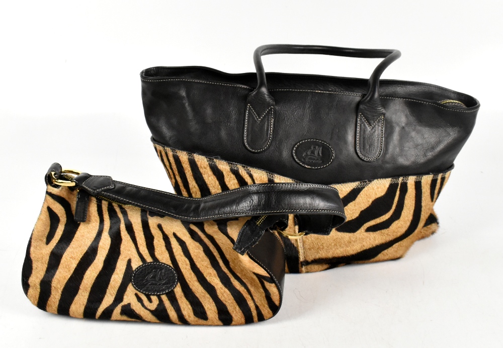 TERRIDA; a 'Tangaroa' black leather and zebra print calf hair large overnight bag with top handles