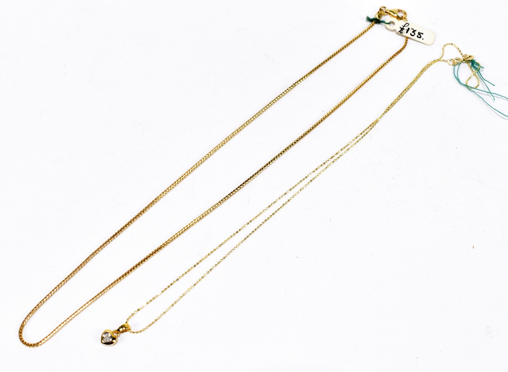 An 18ct yellow gold foxtail chain, length 38cm, approx. 5g, and an 18ct yellow gold fine link