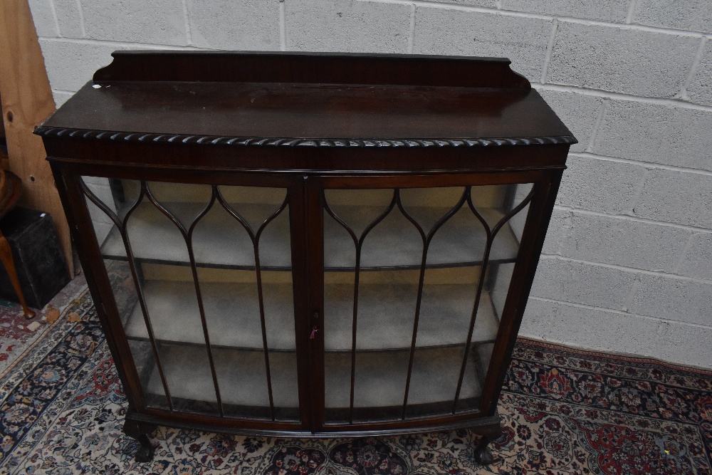 An early 20th century mahogany bowfront display cabinet, the pair of glazed doors enclosing two - Image 2 of 4