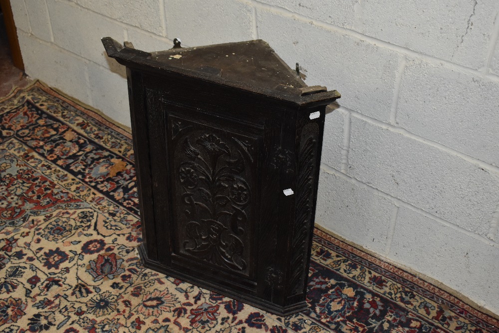 An early 20th century carved oak wall hanging corner cupboard, height 75cm. - Image 3 of 3
