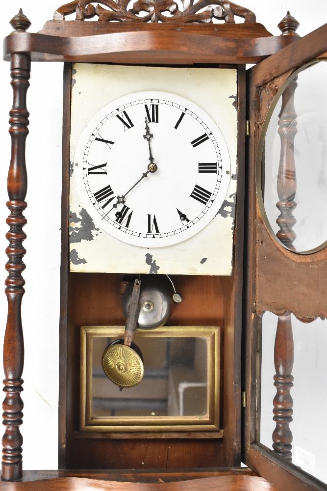 A 19th century American inlaid walnut wall clock with carved pediment above the circular dial set - Image 2 of 2