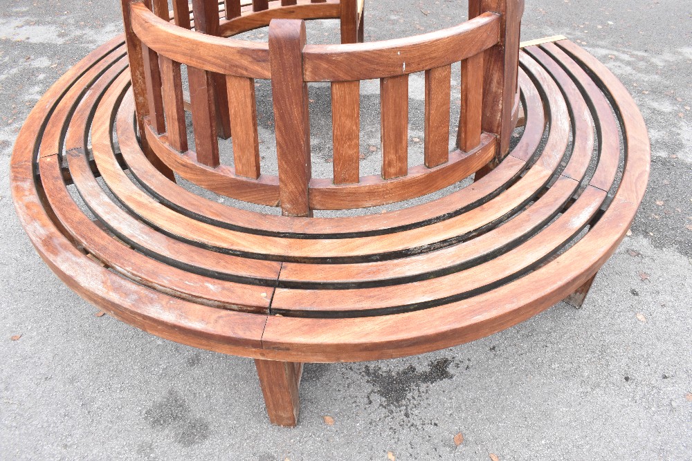 A teak semi-circular garden seat, made to fit around a tree. - Image 2 of 3