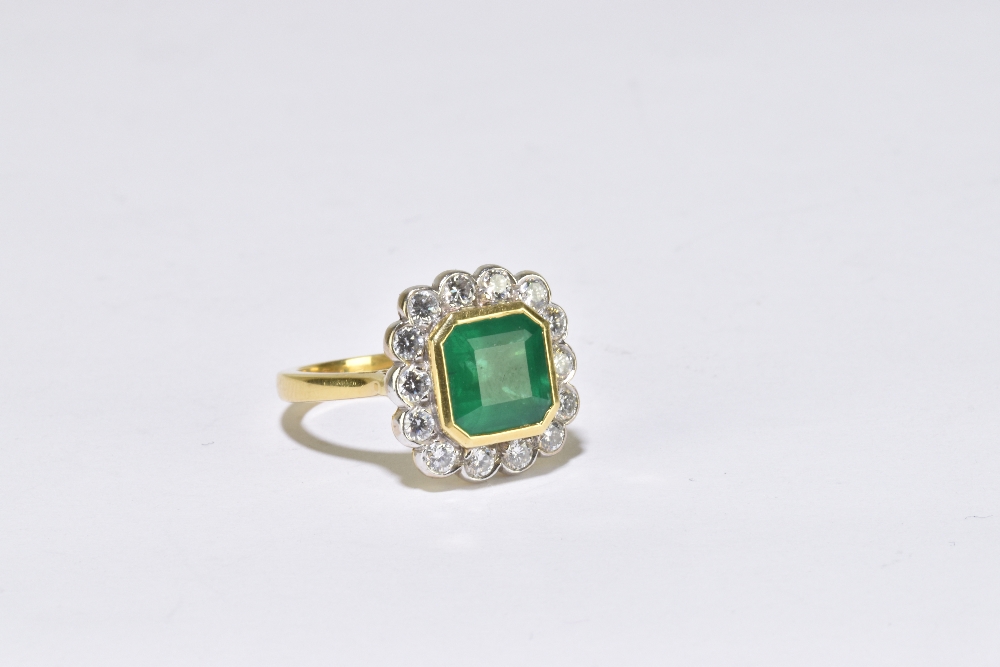 An 18ct yellow gold emerald and diamond ring, the central square cut emerald measuring approx 8mm in - Image 2 of 3