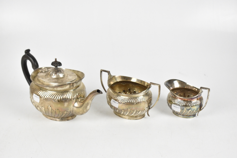 DANIEL & JOHN WELBY; a late Victorian hallmarked silver three piece part gadrooned tea set, length - Image 2 of 4