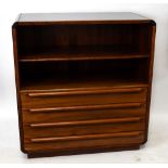 MANNER OF JENSEN FROKJAERAS; a 1970's Danish rosewood chest, with two open shelves and three long