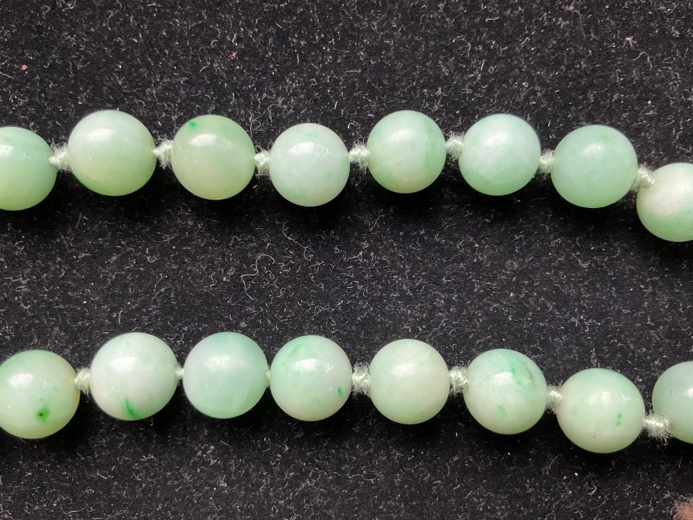 A 1920s/30s jade bead necklace, re-strung and with modern ring loop fastener, length 46cm, each bead - Image 5 of 8