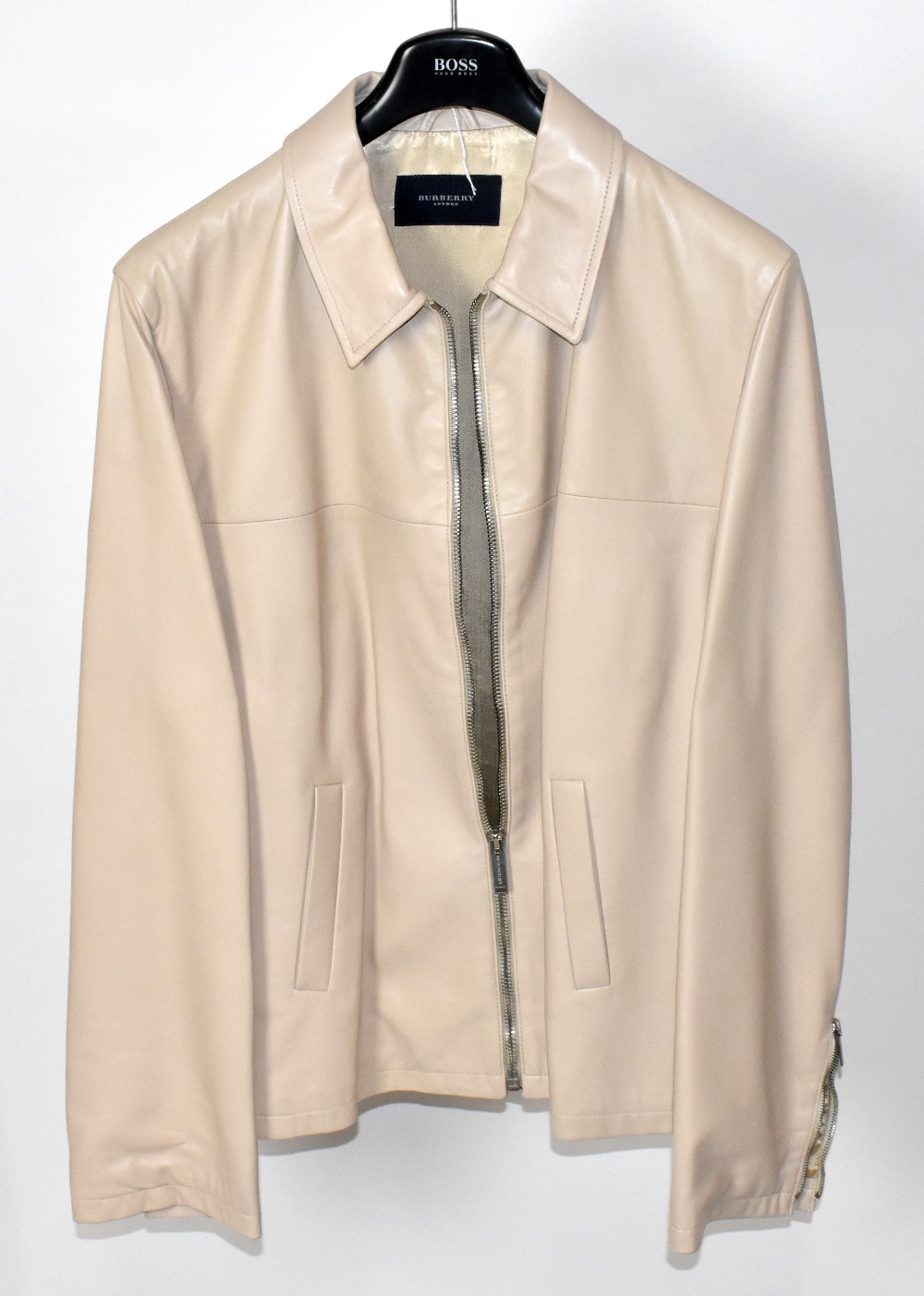 BURBERRY; a cream soft calf skin leather men's zip front jacket fully lined with two zip arm