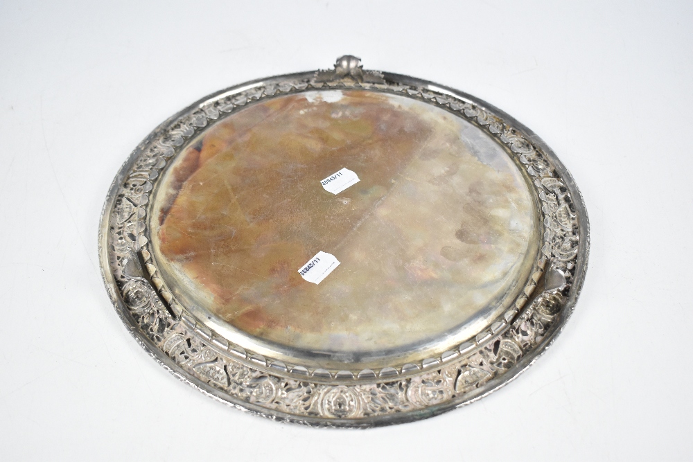 A 19th century white metal circular salver with engraved centre and pierced border, decorated with - Image 4 of 5