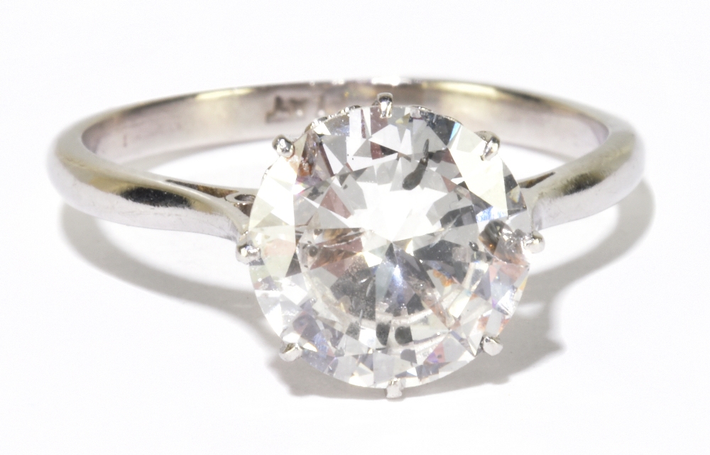 A platinum and diamond solitaire ring, the eight claw set round brilliant cut stone weighing 2.45ct,