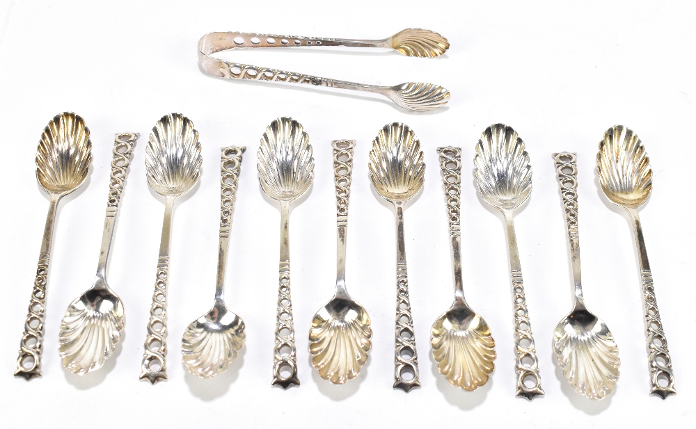 AITKEN BROS; a set of eleven Victorian hallmarked silver teaspoons with shell shaped bowls, and