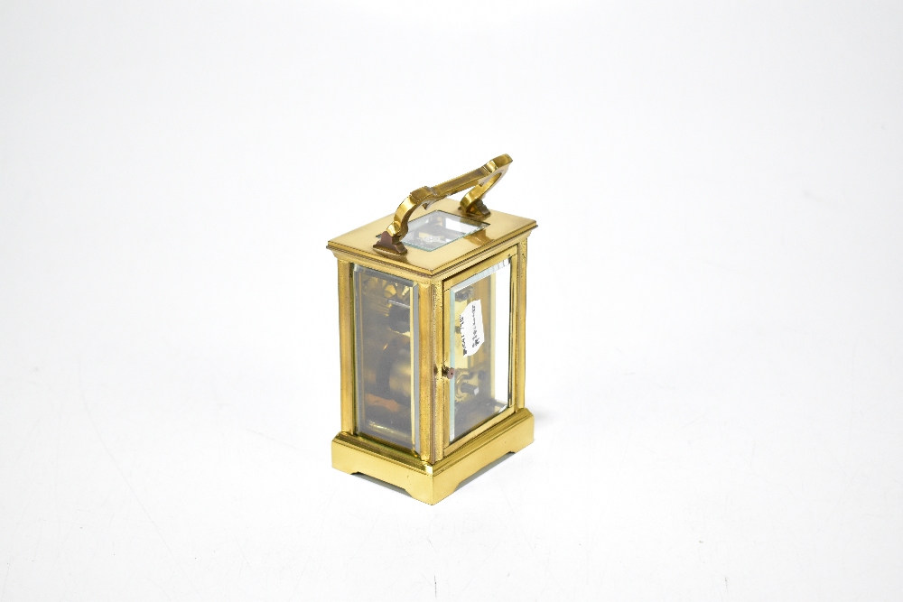 A brass cased carriage clock with rectangular white enamel dial set with Roman numerals, height - Image 2 of 3