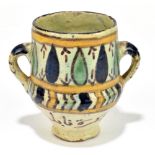 A 19th century Persian pot, height 9cm.