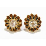 A pair of yellow metal diamond and black enamel ear studs, the old cut diamonds each weighing