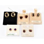 Five pairs of 9ct yellow gold ear studs including garnet example (one lacking butterfly back).
