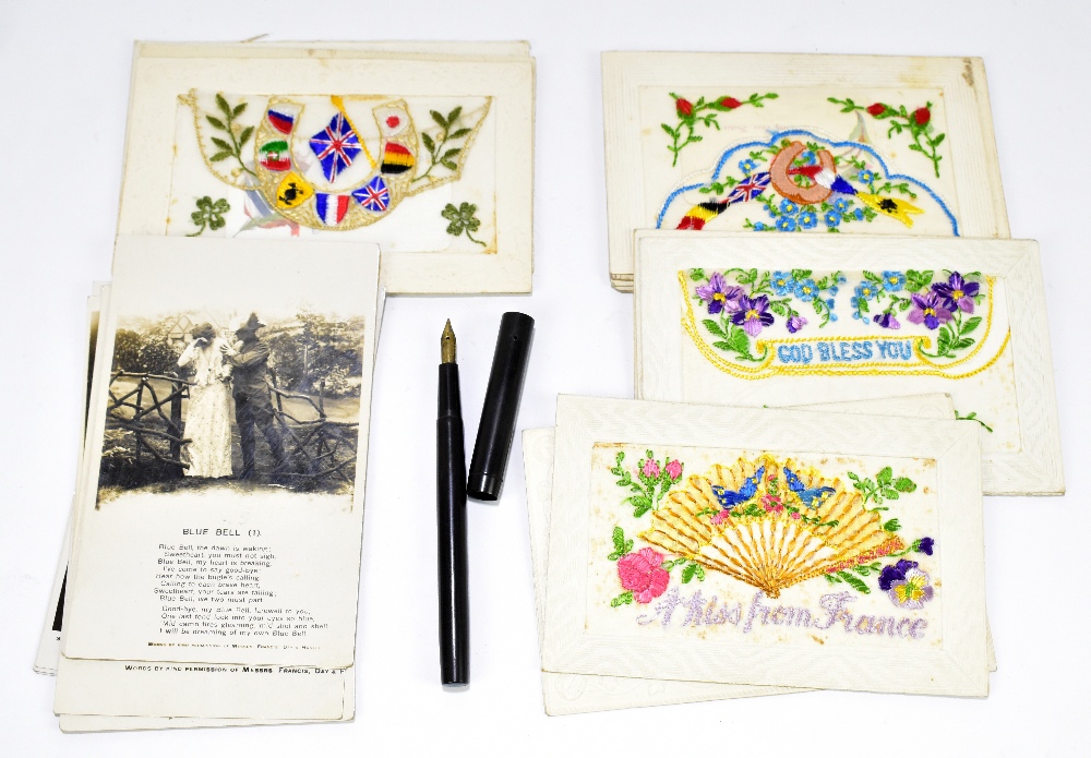 A collection of fourteen WWI period military postcards, each decorated with floral decoration, one