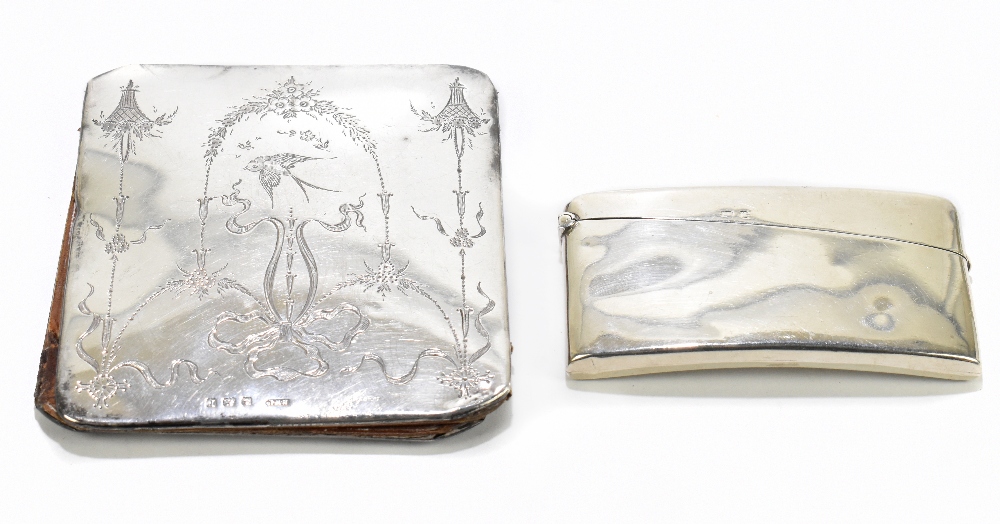HENRY WILLIAMSON LTD; a George V hallmarked silver wallet of shaped rectangular form, with chased
