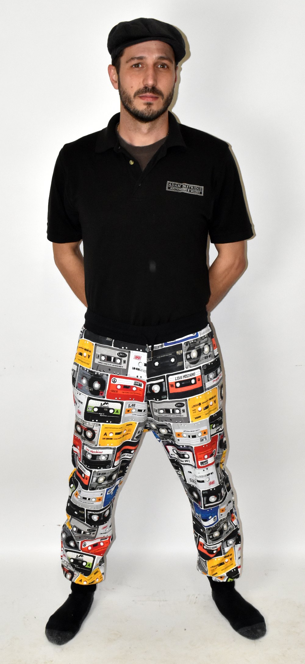 LOVE MOSCHINO; a pair of multi-coloured 100% cotton 'Cassette Tape' print jogging bottoms with two