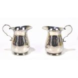 JAMES DIXON & SONS; a pair of George VI hallmarked silver cream jugs of baluster form, Sheffield