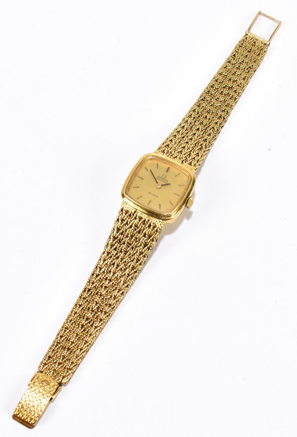 OMEGA; a lady's 18ct yellow gold De Ville wristwatch with integral textured bracelet and rounded