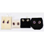 Four pairs of 9ct yellow gold gem set earrings, comprising three pairs set with amethysts and one