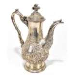 CHARLES WATTS; a George III hallmarked silver coffee pot of baluster form with cast feather finial