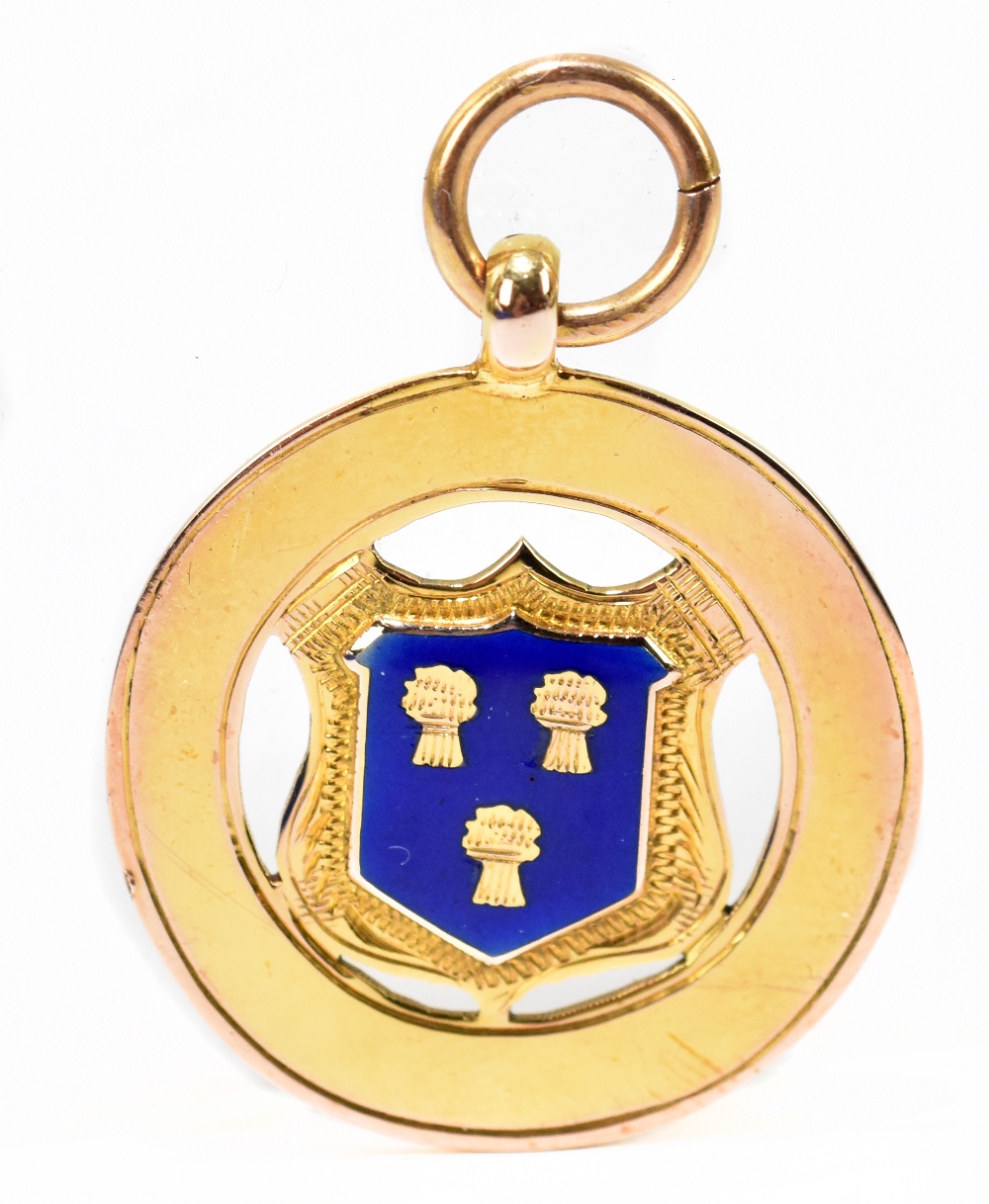 A 9ct yellow gold and blue enamelled fob medallion, with the Cheshire coat of arms to the front