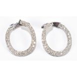 A pair of 18ct white gold full hoop diamond pavé set earrings, length approximately 26mm, 8.35g.