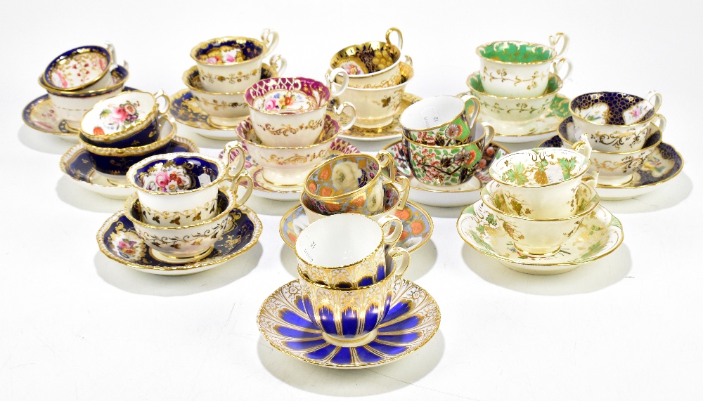 A collection of early 19th century porcelain trios including Imari decorated examples, Coalport