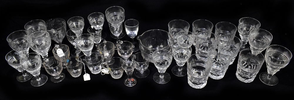 An Edwardian twenty-three piece part suite of drinking glasses, with other 19th century and later