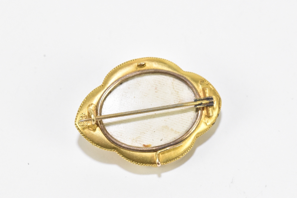 A Victorian yellow metal lozenge shaped brooch, with central enamelled star detail within a filigree - Image 2 of 2