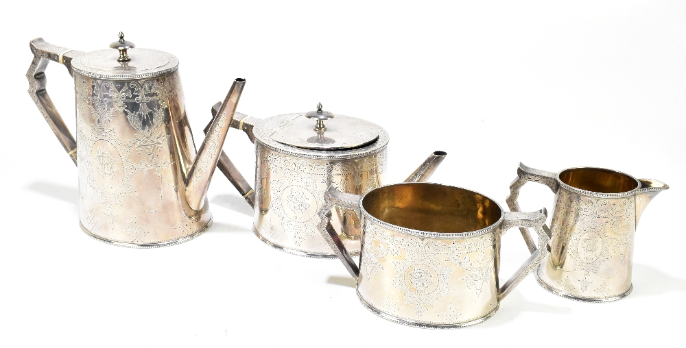 JOSIAH WILLIAMS & CO; a Victorian hallmarked silver four piece tea service, elaborately chased