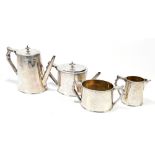 JOSIAH WILLIAMS & CO; a Victorian hallmarked silver four piece tea service, elaborately chased