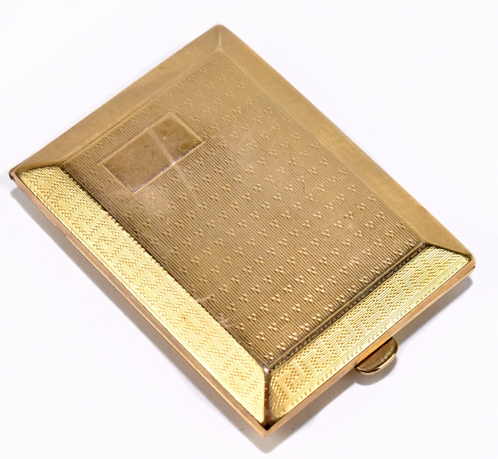 A 9ct yellow gold matchbook case with Greek key engine turned decoration and vacant rectangular