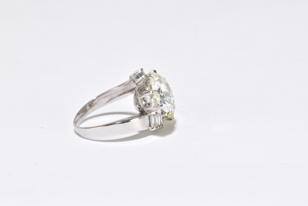 A white metal diamond crossover ring with twin round brilliant cut stones weighing 4.20ct and 3. - Image 3 of 5