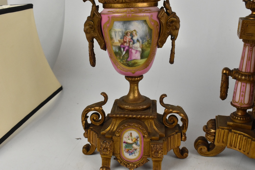 A 19th century French three piece gilt metal clock garniture, with pink and hand painted porcelain - Image 4 of 5