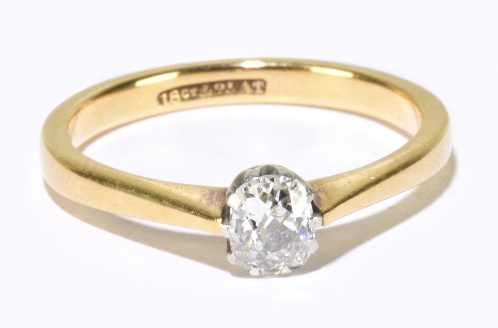 An 18ct yellow gold diamond solitaire ring, the cushion cut stone weighing approx. 0.25cts in ten