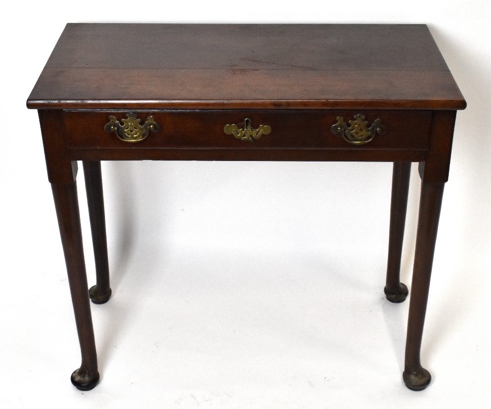 A late 18th century mahogany side table with single drawer on turned column supports terminating