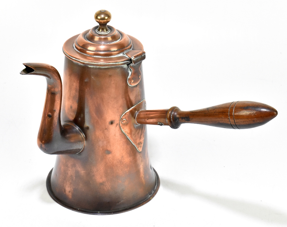 A 19th century copper tavern coffee pot, with wooden handle, height 27cm.