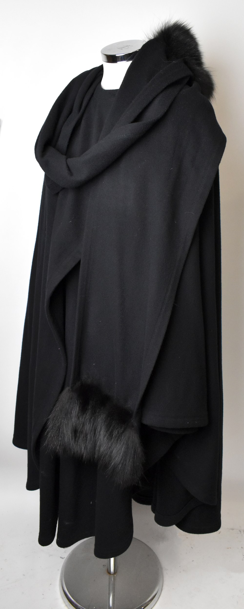 LOUIS FERAUD; a wool and cashmere full length black cape coat with button top slit pockets and a