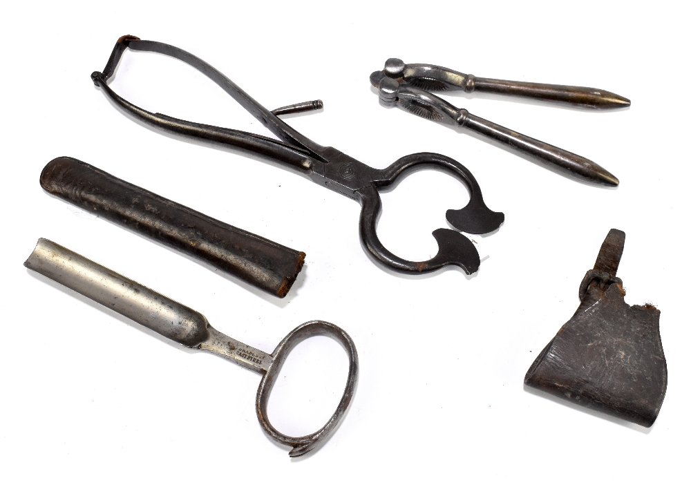 A 19th century steel sugar loaf cutter, together with a nutcracker and horse hoof cleaning tool.