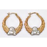A pair of 9ct yellow and white gold creole hoop earrings, featuring a white gold cherub figure