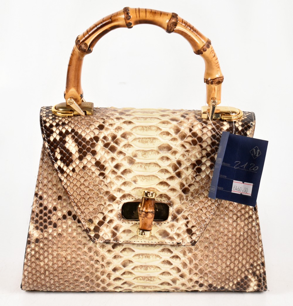 VERO PITONE; a genuine python skin structure leather handbag with a front bamboo and gold tone