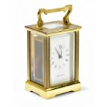 MAPPIN & WEBB; a brass cased carriage clock, the enamel dial set with Roman numerals, height