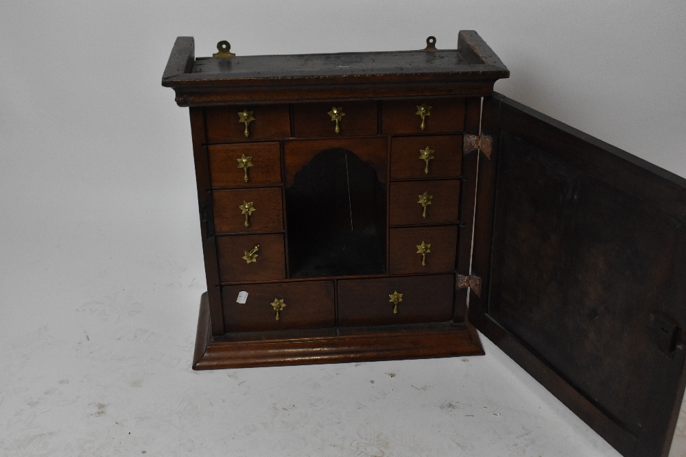 A George III and later hanging spice cabinet, the panelled door enclosing shaped central section - Image 3 of 3