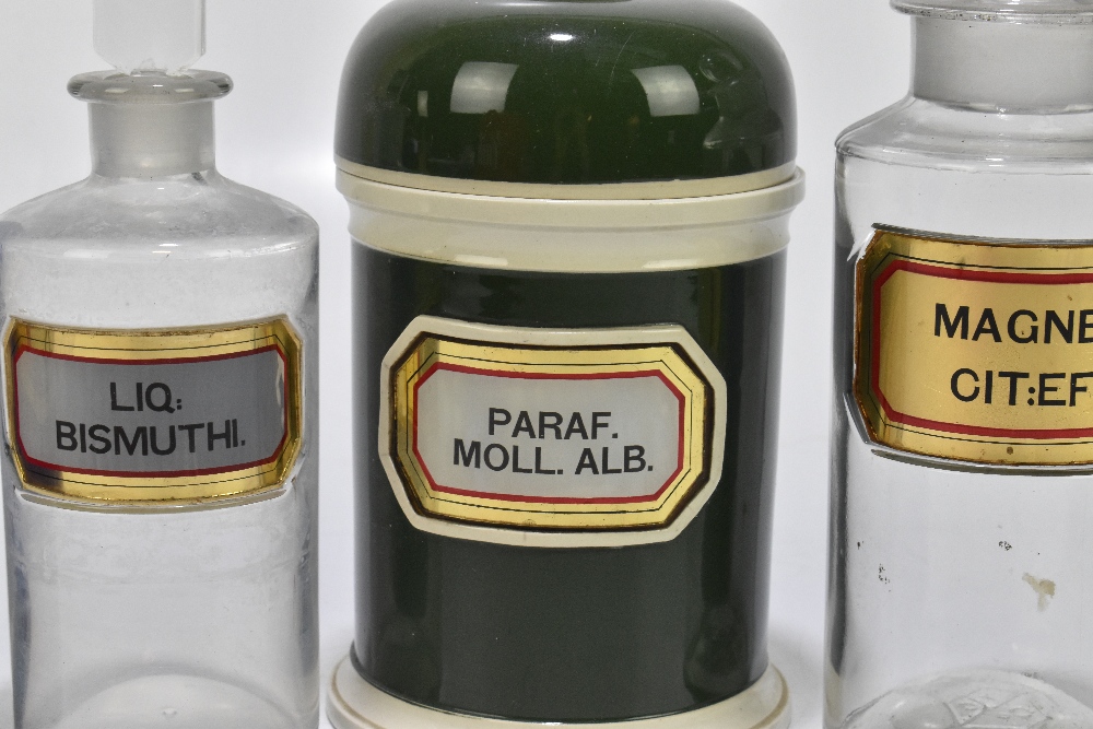 A ceramic apothecary jar with glass label for Paraf. Moll. Alb, height 21cm, and six glass - Image 3 of 4