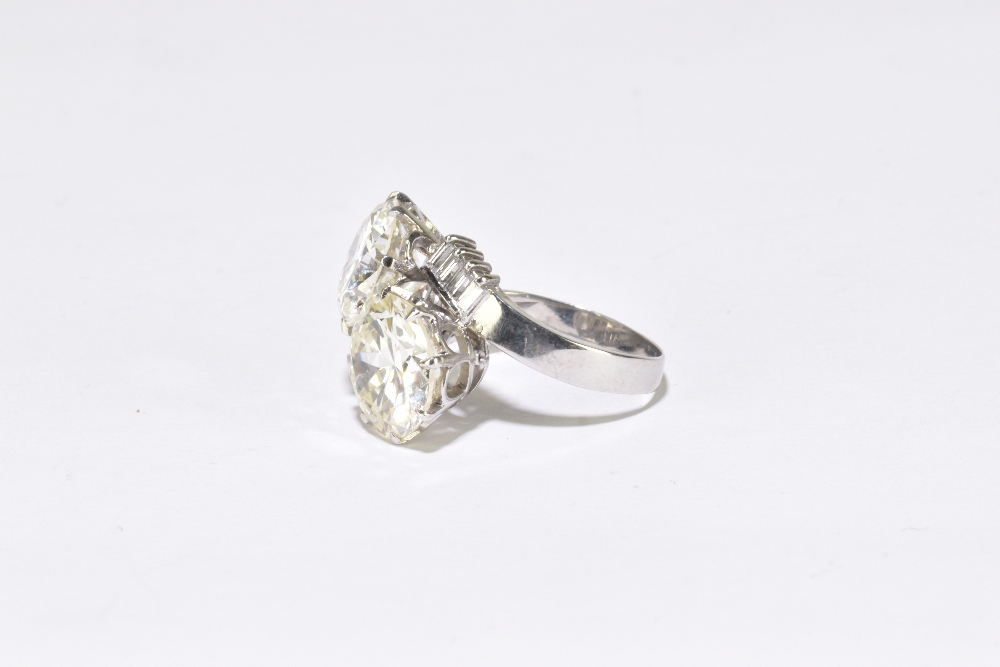 A white metal diamond crossover ring with twin round brilliant cut stones weighing 4.20ct and 3. - Image 4 of 5