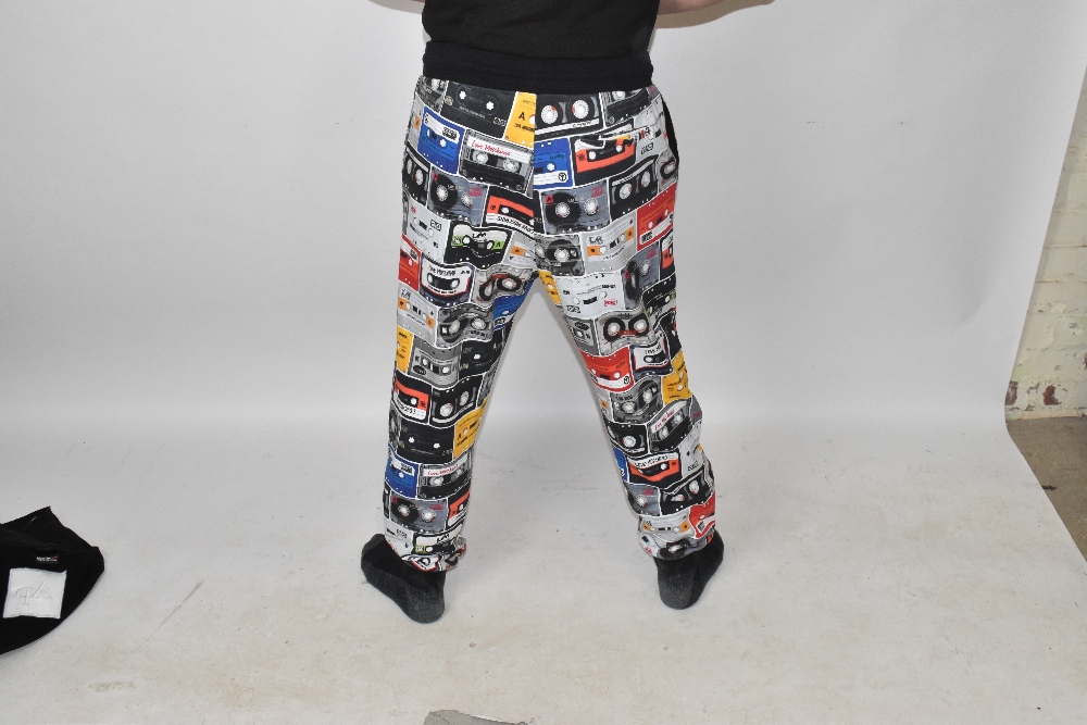 LOVE MOSCHINO; a pair of multi-coloured 100% cotton 'Cassette Tape' print jogging bottoms with two - Image 3 of 5